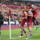 LONDON, ENGLAND - NOVEMBER 12: Lucas Paqueta of West Ham United celebrates with Tomas Soucek and Mohammed Kudus of West Ham United after scoring the team's first goal during the Premier League match between West Ham United and Nottingham Forest at London Stadium on November 12, 2023 in London, England. (Photo by Justin Setterfield/Getty Images)