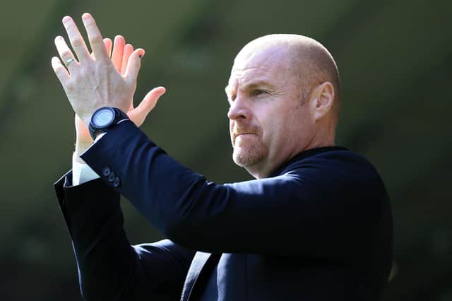 NORWICH, ENGLAND - APRIL 10: Sean Dyche, Manager of Burnley applauds the fans prior to the Premier League match between Norwich City and Burnley at Carrow Road on April 10, 2022 in Norwich, England. (Photo by Stephen Pond/Getty Images)