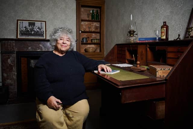 Miriam Margolyes with A Christmas Carol book by Charles Dickens at Gunnersbury Park Museum