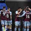 Burnley's Irish defender Nathan Collins (2nd R) celebrates with teammates after scoring their second goal during the English Premier League football match between Burnley and Southampton at Turf Moor in Burnley, north west England on April 21, 2022. - RESTRICTED TO EDITORIAL USE. No use with unauthorized audio, video, data, fixture lists, club/league logos or 'live' services. Online in-match use limited to 120 images. An additional 40 images may be used in extra time. No video emulation. Social media in-match use limited to 120 images. An additional 40 images may be used in extra time. No use in betting publications, games or single club/league/player publications. (Photo by Oli SCARFF / AFP) / RESTRICTED TO EDITORIAL USE. No use with unauthorized audio, video, data, fixture lists, club/league logos or 'live' services. Online in-match use limited to 120 images. An additional 40 images may be used in extra time. No video emulation. Social media in-match use limited to 120 images. An additional 40 images may be used in extra time. No use in betting publications, games or single club/league/player publications. / RESTRICTED TO EDITORIAL USE. No use with unauthorized audio, video, data, fixture lists, club/league logos or 'live' services. Online in-match use limited to 120 images. An additional 40 images may be used in extra time. No video emulation. Social media in-match use limited to 120 images. An additional 40 images may be used in extra time. No use in betting publications, games or single club/league/player publications. (Photo by OLI SCARFF/AFP via Getty Images)