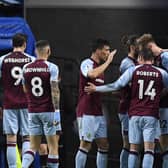 Burnley's Irish defender Nathan Collins (2nd R) celebrates with teammates after scoring their second goal during the English Premier League football match between Burnley and Southampton at Turf Moor in Burnley, north west England on April 21, 2022. - RESTRICTED TO EDITORIAL USE. No use with unauthorized audio, video, data, fixture lists, club/league logos or 'live' services. Online in-match use limited to 120 images. An additional 40 images may be used in extra time. No video emulation. Social media in-match use limited to 120 images. An additional 40 images may be used in extra time. No use in betting publications, games or single club/league/player publications. (Photo by Oli SCARFF / AFP) / RESTRICTED TO EDITORIAL USE. No use with unauthorized audio, video, data, fixture lists, club/league logos or 'live' services. Online in-match use limited to 120 images. An additional 40 images may be used in extra time. No video emulation. Social media in-match use limited to 120 images. An additional 40 images may be used in extra time. No use in betting publications, games or single club/league/player publications. / RESTRICTED TO EDITORIAL USE. No use with unauthorized audio, video, data, fixture lists, club/league logos or 'live' services. Online in-match use limited to 120 images. An additional 40 images may be used in extra time. No video emulation. Social media in-match use limited to 120 images. An additional 40 images may be used in extra time. No use in betting publications, games or single club/league/player publications. (Photo by OLI SCARFF/AFP via Getty Images)