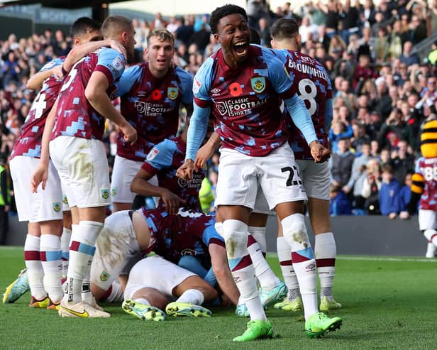 BURNLEY, ENGLAND - NOVEMBER 13: Nathan Tella of Burnley celebrates after teammate Anass Zaroury (obscured) scores their side's second goal during the Sky Bet Championship between Burnley and Blackburn Rovers at Turf Moor on November 13, 2022 in Burnley, England. (Photo by Nathan Stirk/Getty Images)