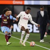 BURNLEY, ENGLAND - SEPTEMBER 23: Marcus Rashford of Manchester United in action with Luca Koleosho of Burnley during the Premier League match between Burnley FC and Manchester United at Turf Moor on September 23, 2023 in Burnley, England. (Photo by Matthew Peters/Manchester United via Getty Images)