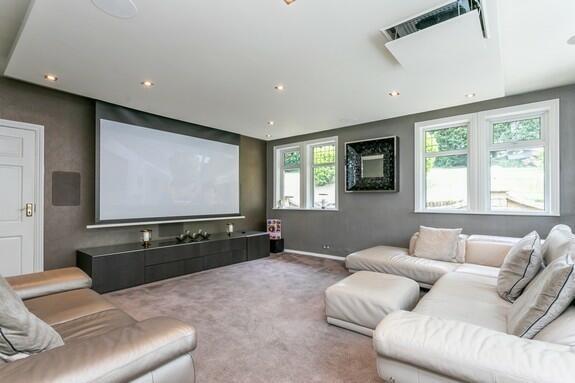 Sitting room with built-in cinema system