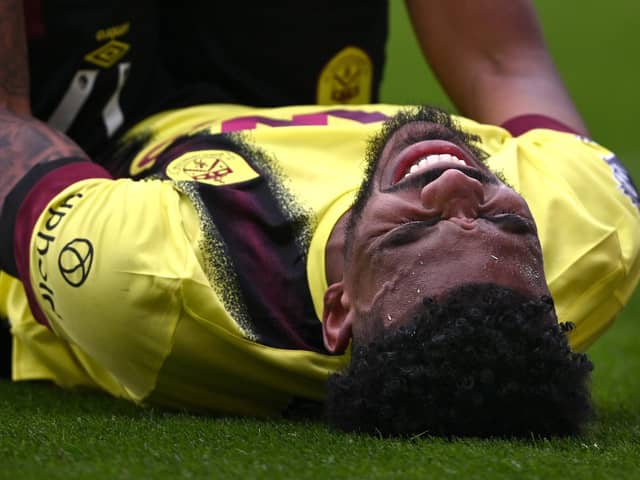 SHEFFIELD, ENGLAND - APRIL 20: Burnley player Lyle Foster reacts after picking up an injury during the Premier League match between Sheffield United and Burnley FC at Bramall Lane on April 20, 2024 in Sheffield, England. (Photo by Stu Forster/Getty Images)