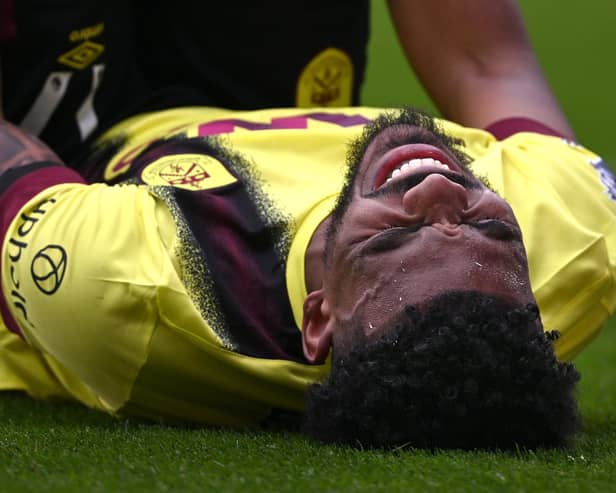 SHEFFIELD, ENGLAND - APRIL 20: Burnley player Lyle Foster reacts after picking up an injury during the Premier League match between Sheffield United and Burnley FC at Bramall Lane on April 20, 2024 in Sheffield, England. (Photo by Stu Forster/Getty Images)