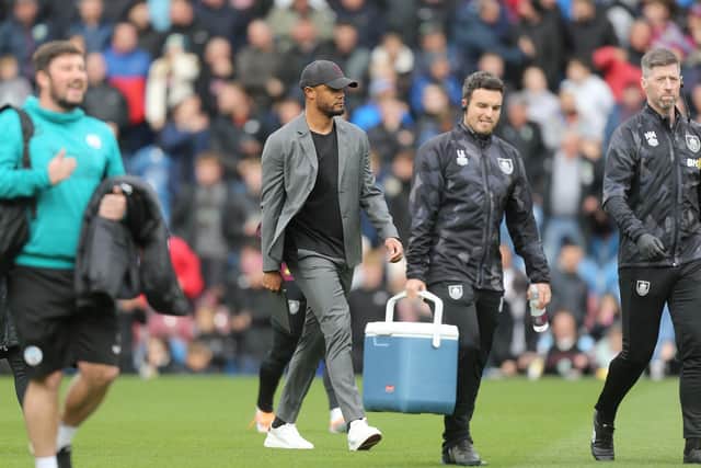 Burnley manager Vincent Kompany (Ctr) makes his way to the dugout with his coaching staff

The EFL Sky Bet Championship - Burnley v Swansea City - Saturday 15th October 2022 - Turf Moor - Burnley