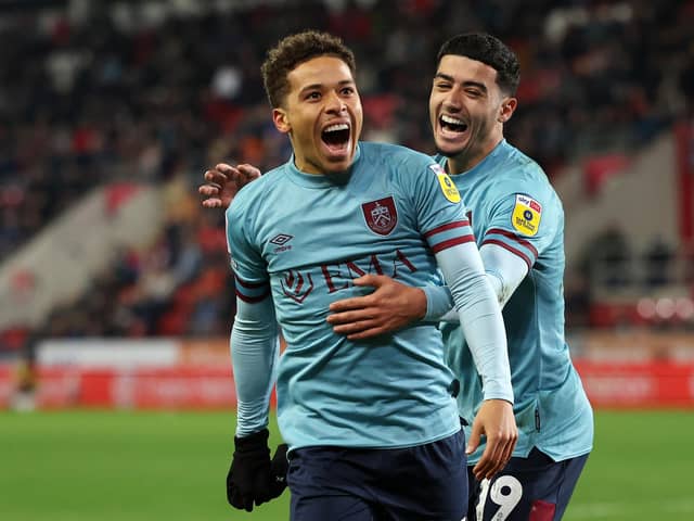 ROTHERHAM, ENGLAND - APRIL 18: Manuel Benson of Burnley celebrates with teammate Anass Zaroury after scoring the team's second goal during the Sky Bet Championship match between Rotherham United and Burnley at AESSEAL New York Stadium on April 18, 2023 in Rotherham, England. (Photo by Matt McNulty/Getty Images)