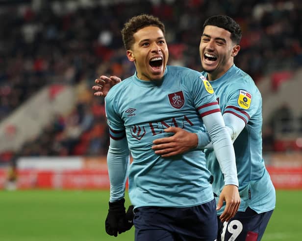 ROTHERHAM, ENGLAND - APRIL 18: Manuel Benson of Burnley celebrates with teammate Anass Zaroury after scoring the team's second goal during the Sky Bet Championship match between Rotherham United and Burnley at AESSEAL New York Stadium on April 18, 2023 in Rotherham, England. (Photo by Matt McNulty/Getty Images)