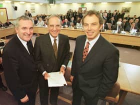 ​Bertie Ahern, Senator George Mitchell and Tony Blair after the signing of the agreement on April 10 1998