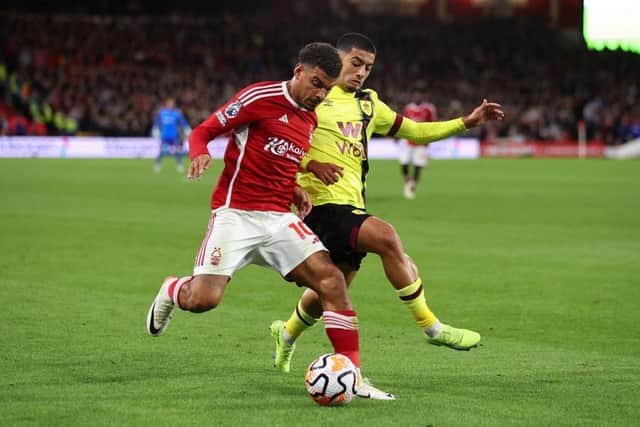 NOTTINGHAM, ENGLAND - SEPTEMBER 18:  Morgan Gibbs-White of Nottingham Forest in action with Anass Zaroury of Burnley during the Premier League match between Nottingham Forest and Burnley FC at City Ground on September 18, 2023 in Nottingham, United Kingdom. (Photo by Marc Atkins/Getty Images)