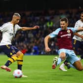 BURNLEY, ENGLAND - APRIL 06: Richarlison of Everton controls the ball under pressure from James Tarkowski of Burnley  during the Premier League match between Burnley and Everton at Turf Moor on April 06, 2022 in Burnley, England. (Photo by Clive Brunskill/Getty Images)