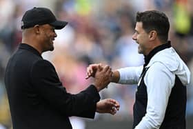 Burnley's Belgian manager Vincent Kompany (L) greets Chelsea's Argentinian head coach Mauricio Pochettino ahead of the English Premier League football match between Burnley and Chelsea at Turf Moor in Burnley, north-west England on October 7, 2023. (Photo by Oli SCARFF / AFP)