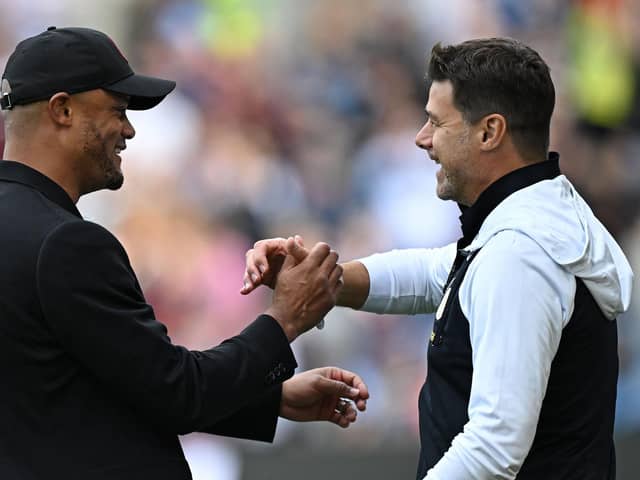 Burnley's Belgian manager Vincent Kompany (L) greets Chelsea's Argentinian head coach Mauricio Pochettino ahead of the English Premier League football match between Burnley and Chelsea at Turf Moor in Burnley, north-west England on October 7, 2023. (Photo by Oli SCARFF / AFP)