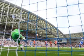 BRIGHTON, ENGLAND - AUGUST 12: (EDITORS NOTE: In this photo taken from a remote camera from behind the goal.) A general view as Joao Pedro of Brighton & Hove Albion scores the team's second goal from a penalty kick past Thomas Kaminski of Luton Town during the Premier League match between Brighton & Hove Albion and Luton Town at American Express Community Stadium on August 12, 2023 in Brighton, England. (Photo by Mike Hewitt/Getty Images)