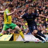 NORWICH, ENGLAND - APRIL 10: Charlie Taylor of Burnley and Sam Byram of Norwich City battle for the ball  during the Premier League match between Norwich City and Burnley at Carrow Road on April 10, 2022 in Norwich, England. (Photo by Paul Harding/Getty Images)