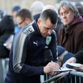 BURNLEY, ENGLAND - JANUARY 01: Dean Marney of Burnley signs autographs as he arrives at the stadium prior to the Premier League match between Burnley and Liverpool at Turf Moor on January 1, 2018 in Burnley, England.  (Photo by Ian MacNicol/Getty Images)