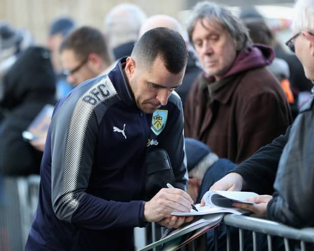 BURNLEY, ENGLAND - JANUARY 01: Dean Marney of Burnley signs autographs as he arrives at the stadium prior to the Premier League match between Burnley and Liverpool at Turf Moor on January 1, 2018 in Burnley, England.  (Photo by Ian MacNicol/Getty Images)