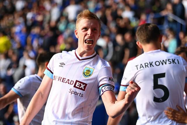 LEICESTER, ENGLAND - SEPTEMBER 25: Ben Mee of Burnley celebrates a goal scored by Chris Wood of Burnley (not pictured) which is later disallowed for offside during the Premier League match between Leicester City and Burnley at The King Power Stadium on September 25, 2021 in Leicester, England. (Photo by Clive Mason/Getty Images)