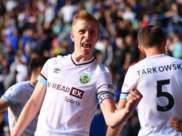 LEICESTER, ENGLAND - SEPTEMBER 25: Ben Mee of Burnley celebrates a goal scored by Chris Wood of Burnley (not pictured) which is later disallowed for offside during the Premier League match between Leicester City and Burnley at The King Power Stadium on September 25, 2021 in Leicester, England. (Photo by Clive Mason/Getty Images)