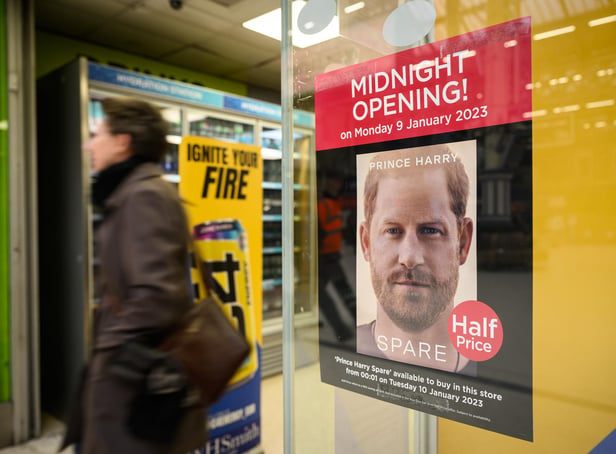 <p>A poster advertising the launch of Prince Harry's memoir, Spare, on sale from today, is seen in a shop window (Picture: Leon Neal/Getty Images)</p>