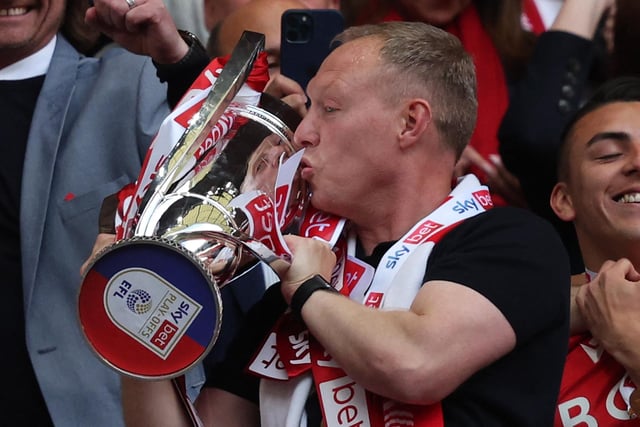 Nottingham Forest's Welsh manager Steve Cooper celebrates as he kisses the Championship Playoff trophy after Nottingham Forest's victory at the end of the English Championship play-off final football match between Huddersfield Town and Nottingham Forest at Wembley Stadium in London, on May 29, 2022.