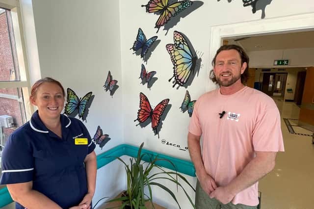 Emma Stoddard (Ward Manager) and Christian Fenn, in front of a new butterfly mural at Blackpool Victoria Hospital designed to inspire hope.
