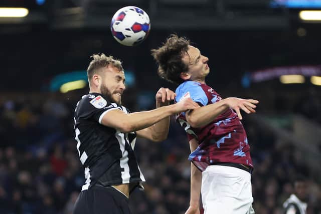 BURNLEY, ENGLAND - FEBRUARY 14: Hjalmar Ekdal of Burnley battles for the ball with Ryan Porteous of Watford during the Sky Bet Championship between Burnley and Watford at Turf Moor on February 14, 2023 in Burnley, England. (Photo by Clive Brunskill/Getty Images)