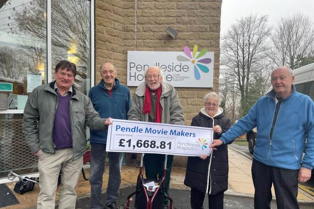 Pendle Movie Makers, from the left, Howard Greenwood, Ken Holgate, Peter Copestake, Gillian Herbert and Graham Hayes with the cheque for Pendleside Hospice.