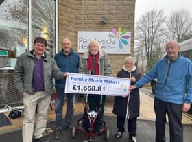 Pendle Movie Makers, from the left, Howard Greenwood, Ken Holgate, Peter Copestake, Gillian Herbert and Graham Hayes with the cheque for Pendleside Hospice.