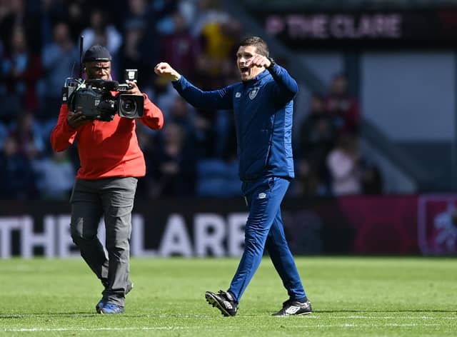 BURNLEY, ENGLAND - APRIL 24: Michael Jackson, Caretaker Manager of Burnley celebrates after their sides victory during the Premier League match between Burnley and Wolverhampton Wanderers at Turf Moor on April 24, 2022 in Burnley, England. (Photo by Gareth Copley/Getty Images)