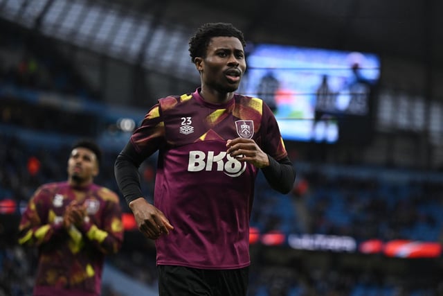 Burnley's English striker Nathan Tella (C) warms up ahead of kick-off in the English FA Cup quarter-final football match between Manchester City and Burnley at the Etihad Stadium in Manchester, north-west England, on March 18, 2023. (Photo by Oli SCARFF / AFP)