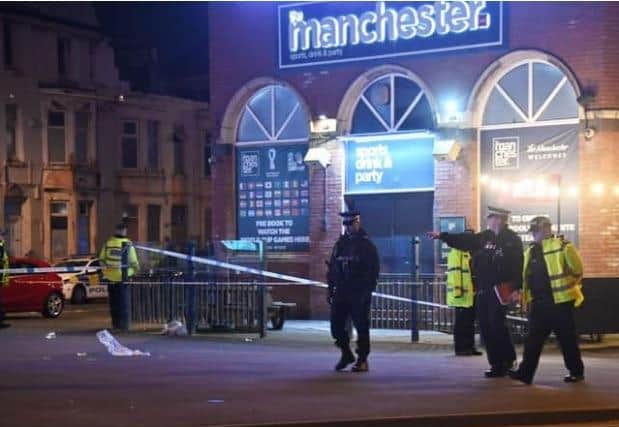 Police outside the Manchester pub following the incident.