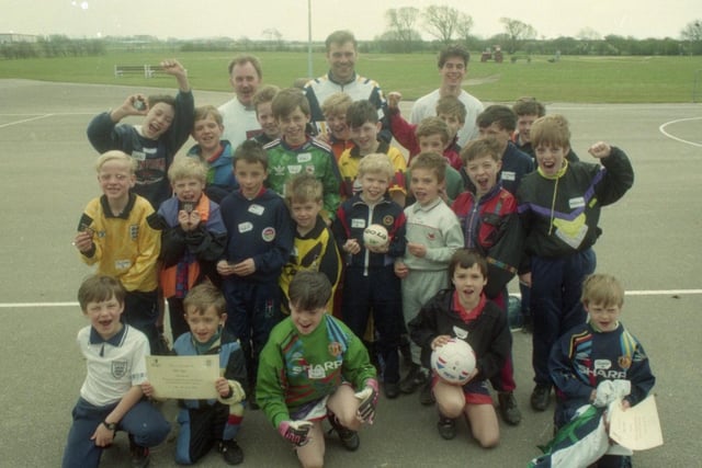 A Lancashire factory scored with youngsters after holding an Easter soccer school for them. Staff at British Aerospace's Warton site, near Blackpool, invited children at local schools and the children of employees to their four football courses run by the Lancashire Football Association. The children are pictured with PNE's Glenn Johnstone and coaches Darren Bowles and Tony Duckworth