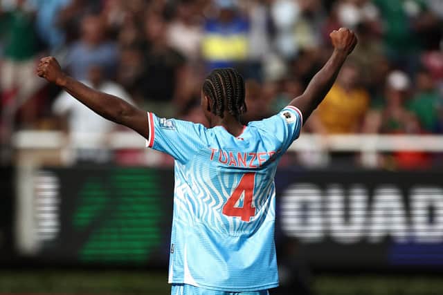 Tuanzebe celebrates after sending DR Congo to the World Cup (Photo by Ulises Ruiz / AFP via Getty Images)