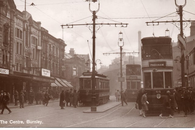 Still in the Tram Centre, with the Palace and Grand Theatres, to the left, and the Hall Inn, to their right, this image shows three trams, number 62, to Nelson, 68, for Padiham and 72, to Brunshaw. Note that one of the trams is a single-decker and, if you look carefully, you can see the complicated arrangements made to deal with the electric cables that provided the power.