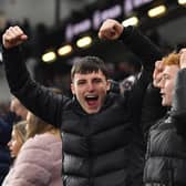 A Burnley fan celebrates at Turf Moor

The EFL Sky Bet Championship - Burnley v West Bromwich Albion - Friday 20th January 2023 - Turf Moor - Burnley