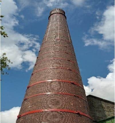 The 120 ft high Chimney Looms
