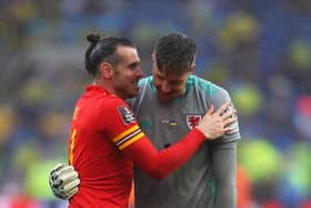Wales' striker Gareth Bale (L) celebrates with Wales' goalkeeper Wayne Hennessey after winning  the FIFA World Cup 2022 play-off final qualifier football match between Wales and Ukraine at the Cardiff City Stadium in Cardiff, south Wales, on June 5, 2022. (Photo by Geoff Caddick / AFP) (Photo by GEOFF CADDICK/AFP via Getty Images)