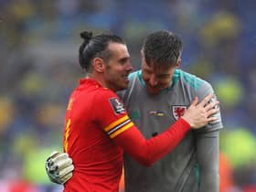 Wales' striker Gareth Bale (L) celebrates with Wales' goalkeeper Wayne Hennessey after winning  the FIFA World Cup 2022 play-off final qualifier football match between Wales and Ukraine at the Cardiff City Stadium in Cardiff, south Wales, on June 5, 2022. (Photo by Geoff Caddick / AFP) (Photo by GEOFF CADDICK/AFP via Getty Images)