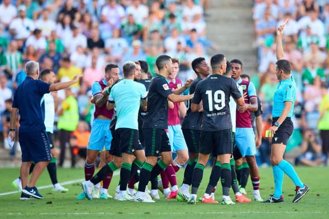 HUELVA, SPAIN - JULY 28: Referee shows a red card to Luiz Felipe of Real Betis during a Pre Season Friendly Match between Real Betis and Burnley FC at Estadio Nuevo Colombino on July 28, 2023 in Huelva, Spain. (Photo by Fran Santiago/Getty Images)