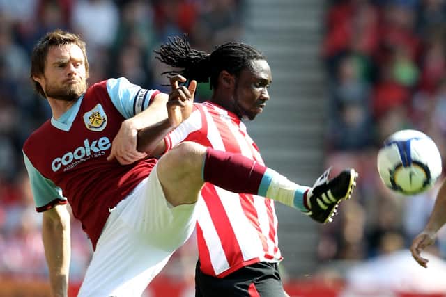 SUNDERLAND, ENGLAND - APRIL 17:  Graham Alexander of Burnley is challenged by Kenwyne Jones of Sunderland during the Barclays Premier League match between Sunderland and Burnley at the Stadium of Light on April 17, 2010 in Sunderland, England.  (Photo by Ross Kinnaird/Getty Images)