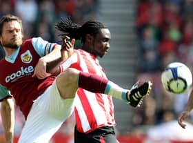 SUNDERLAND, ENGLAND - APRIL 17:  Graham Alexander of Burnley is challenged by Kenwyne Jones of Sunderland during the Barclays Premier League match between Sunderland and Burnley at the Stadium of Light on April 17, 2010 in Sunderland, England.  (Photo by Ross Kinnaird/Getty Images)
