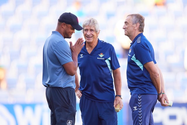 HUELVA, SPAIN - JULY 28: Manuel Pellegrini, manager of Real Betis speaks with Vincent Kompany, manager of Burnley FC prior to a Pre Season Friendly Match between Real Betis and Burnley FC at Estadio Nuevo Colombino on July 28, 2023 in Huelva, Spain. (Photo by Fran Santiago/Getty Images)