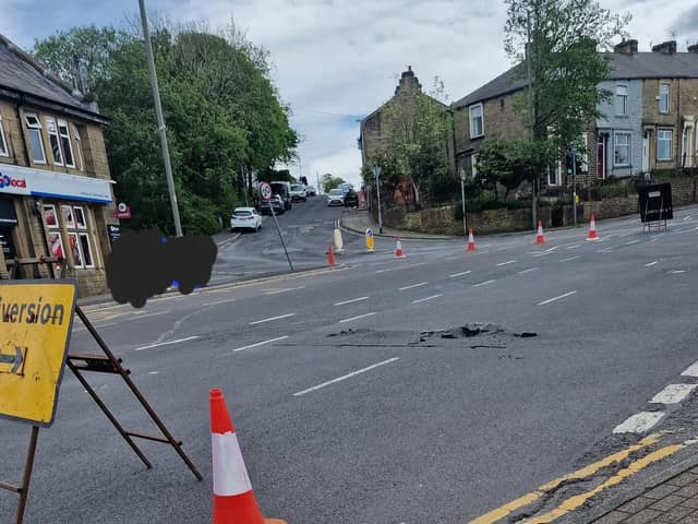 A section of Manchester Road in Burnley remains closed for flood repairs