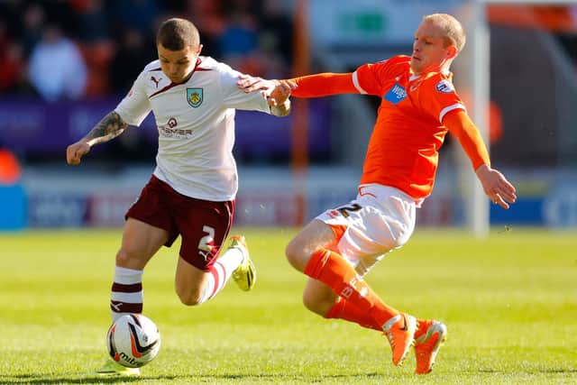 BLACKPOOL, ENGLAND - APRIL 18: Neal Bishop (R) of Blackpool in action with Kieran Trippier of Burnley during the Sky Bet Championship match between Blackpool and Burnley at Bloomfield Road on April 18, 2014 in Blackpool, England. (Photo by Paul Thomas/Getty Images)