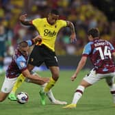 WATFORD, ENGLAND - AUGUST 12: Joao Pedro of Watford is challenged by Taylor Harwood-Bellis of Burnley during the Sky Bet Championship between Watford and Burnley at Vicarage Road on August 12, 2022 in Watford, England. (Photo by Richard Heathcote/Getty Images)