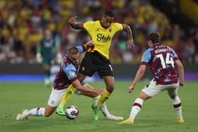 WATFORD, ENGLAND - AUGUST 12: Joao Pedro of Watford is challenged by Taylor Harwood-Bellis of Burnley during the Sky Bet Championship between Watford and Burnley at Vicarage Road on August 12, 2022 in Watford, England. (Photo by Richard Heathcote/Getty Images)