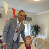 Mayor Coun. Raja Arif Khan with Edith Howson at Dove Court Care Home in Burnley.
