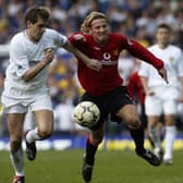 30 Mar 2002:  Jonathan Woodgate (left) of Leeds United and Diego Forlan (right) of Manchester United run after a loose ball during the FA Barclaycard Premiership match played at Elland Road, in Leeds, England. Manchester United won the match 4-3. DIGITALIMAGE. \ Mandatory Credit: Laurence Griffiths/Getty Images